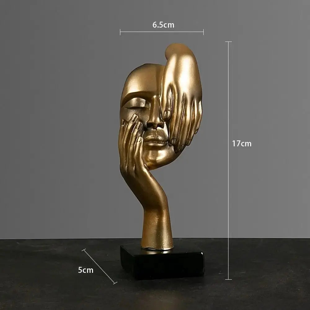 Figur als Gesicht in Gold