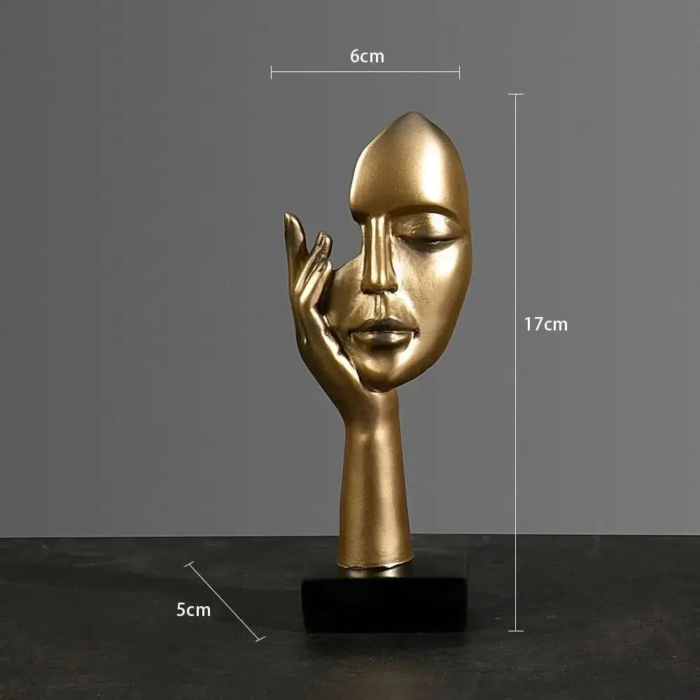Figur als Gesicht in Gold