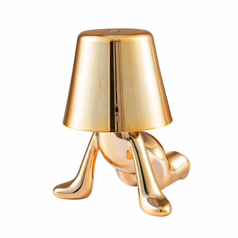 Goldene Figur als Tischlampe