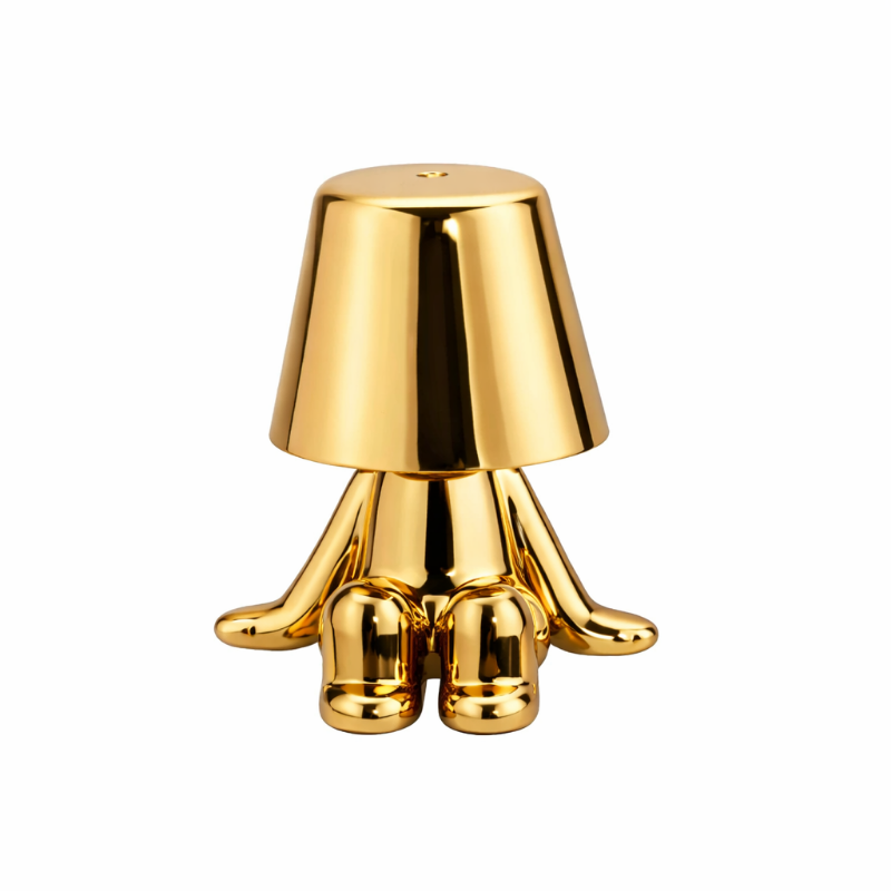 Goldene Figur als Tischlampe